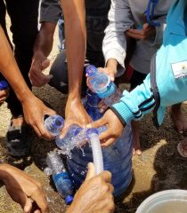 people receiving clean water