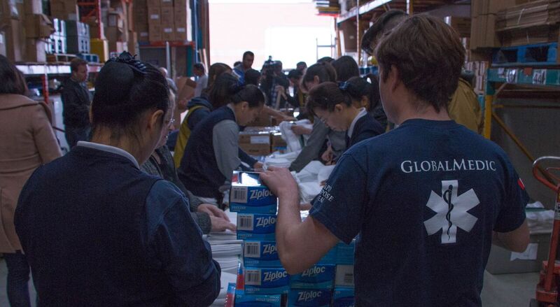 A group of volunteers packing hygiene kits to support Canadians in Fort McMurray