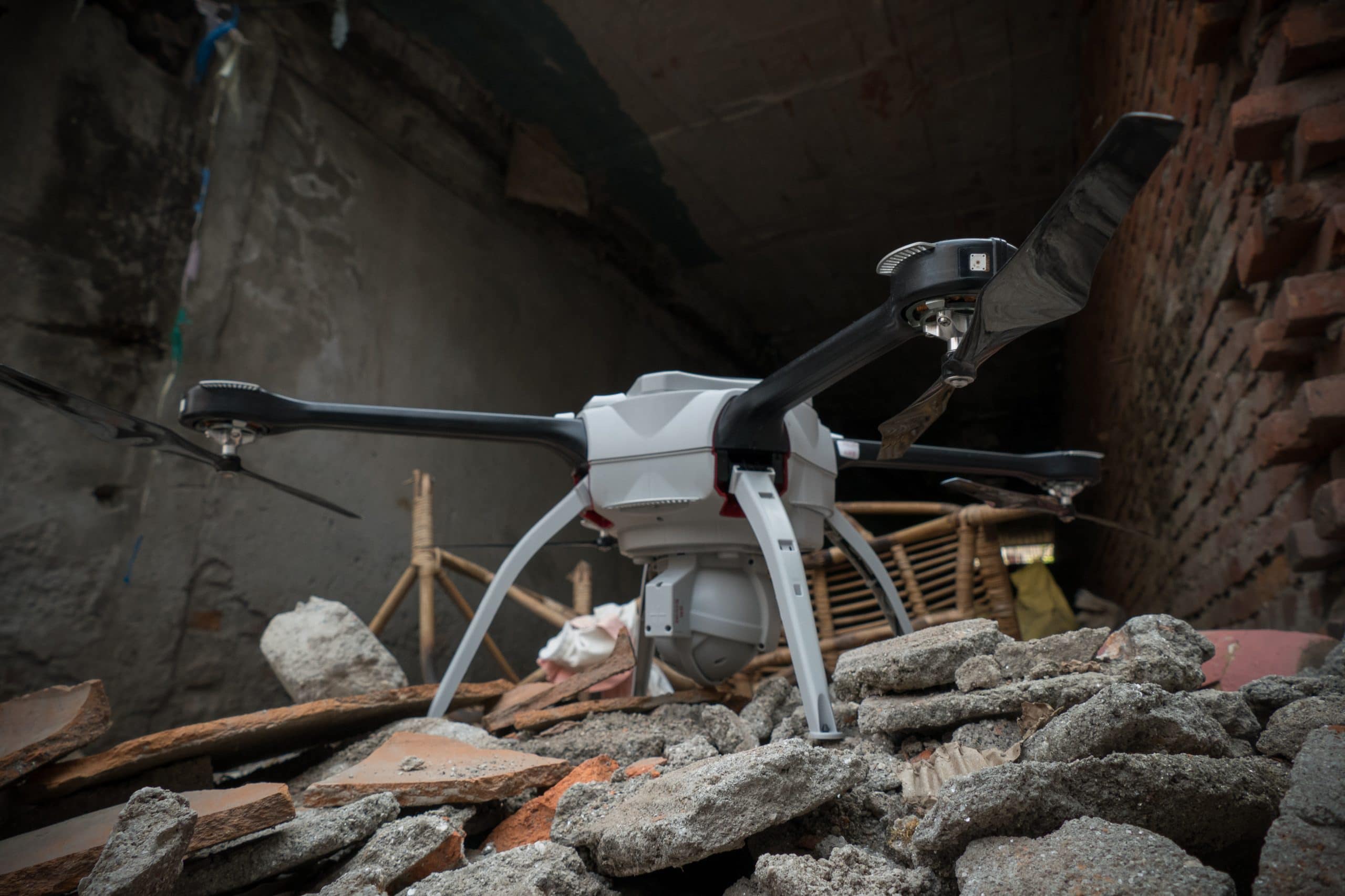 A UAV about to take off from a pile of rubble in Nepal