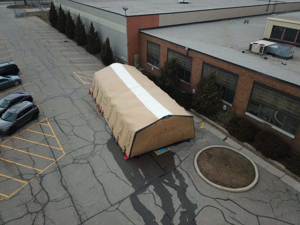 Aerial view of military tent set up in a parking lot