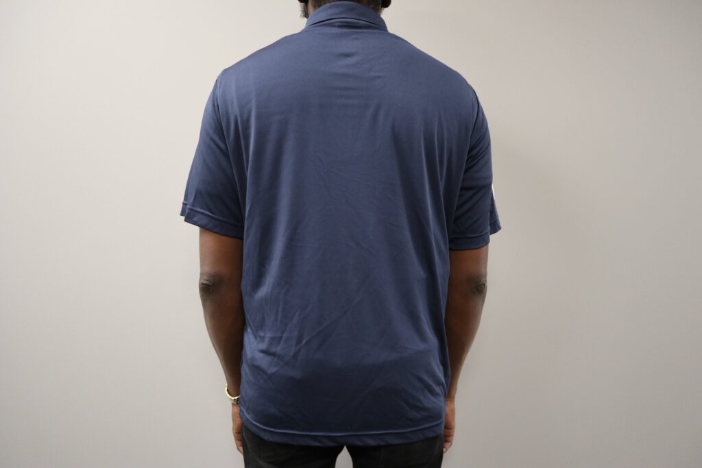 Back of a man wearing a blue GlobalMedic polo shirt